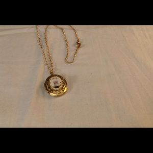 Vintage style gold tone locket with raised rose  flower.